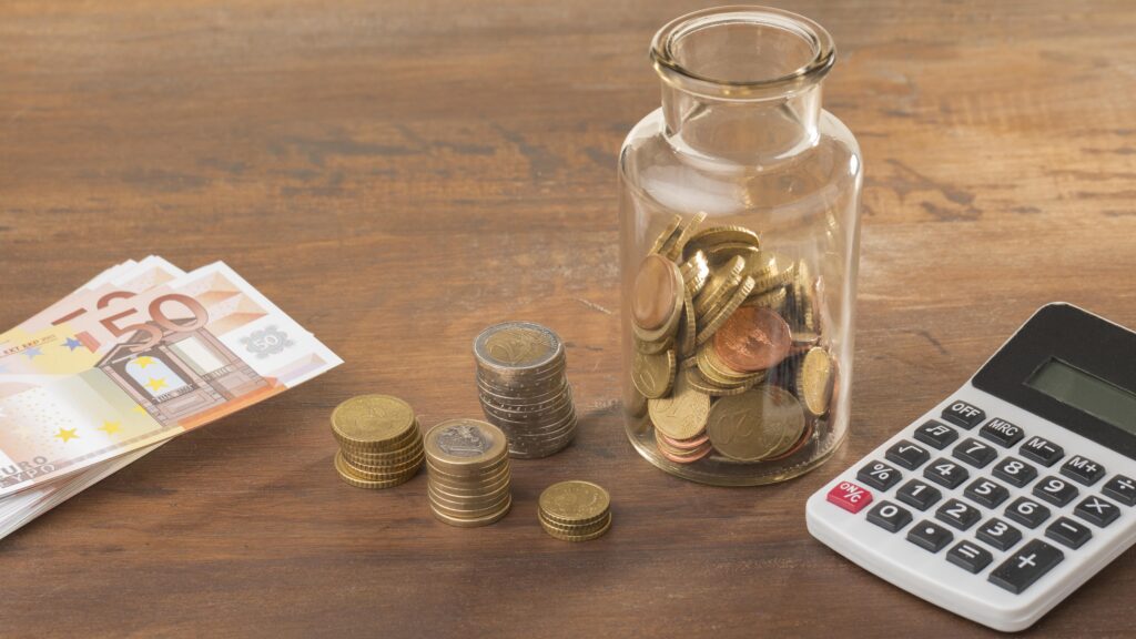 Savings with Coins and Cash of Euro Currency